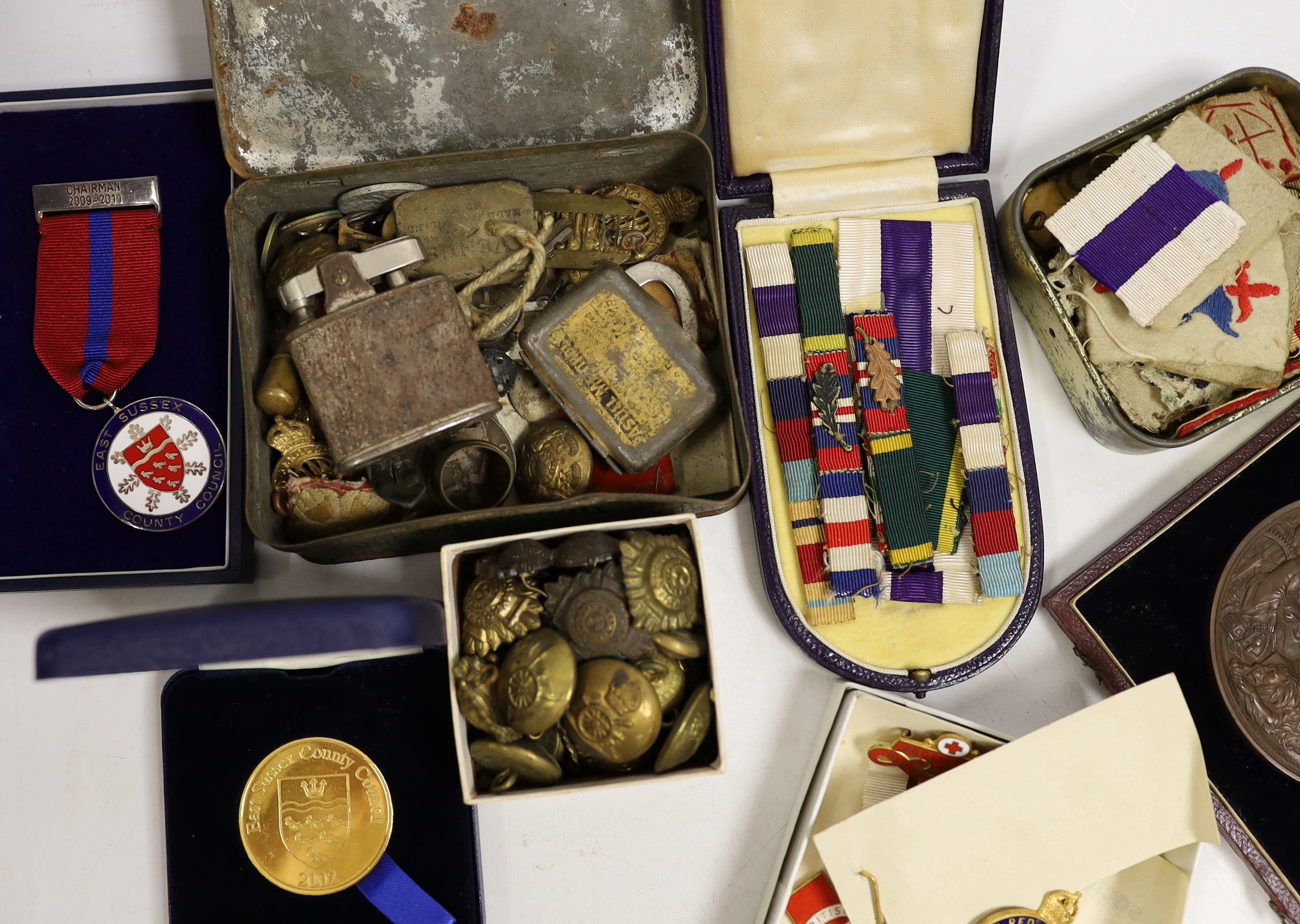 A quantity of medallions, badges etc including some military interest